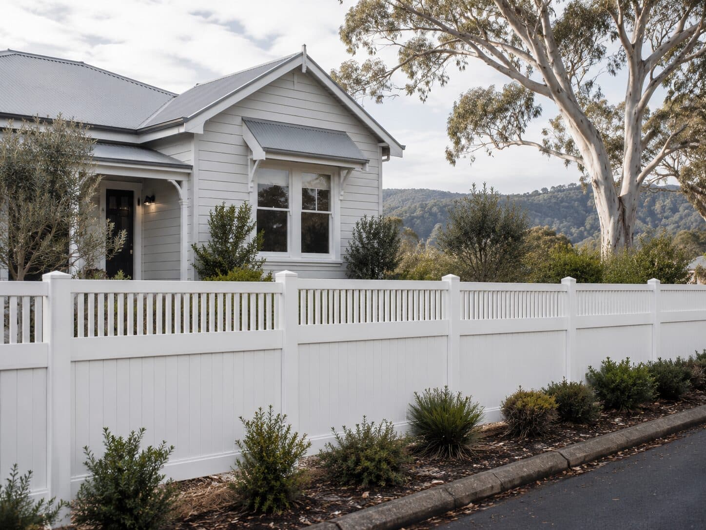 Eton 1.8 metre closed-top fence in a hinterland setting with mountain backdrop.